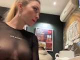 Flashing her big boobs in transparent top in public cafe.