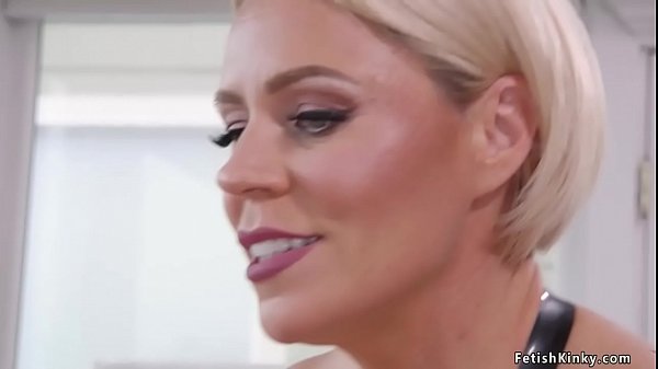 Blonde MILF femdom housewife Helena Locke in latex and black stockings zappers tied blond man slave Sherman Maus in the kitchen then gives him pegging with monster strap on cock